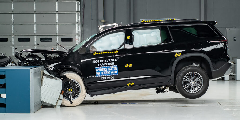 sideview of crash test suv with front damage